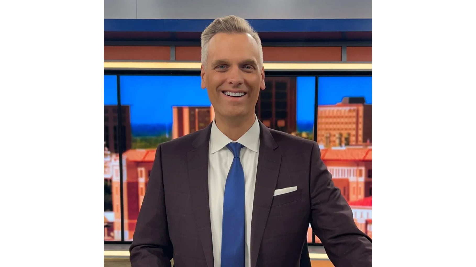 FOX 34 Lubbock news anchor James Eppler smiling in a suit and tie in front of a news studio backdrop.