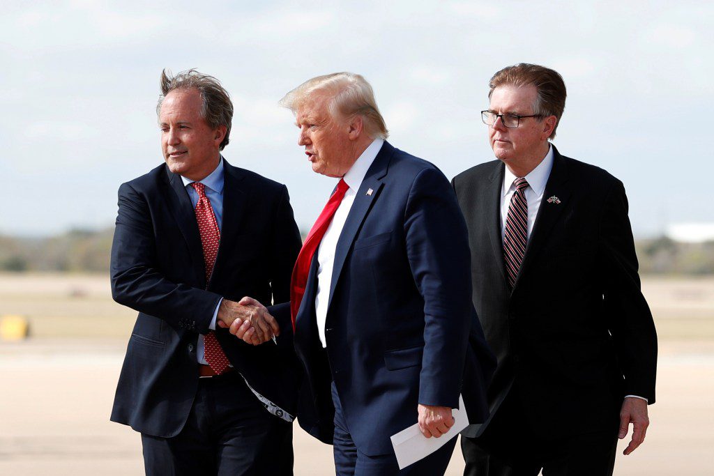 Donald Trump walking alongside Ken Paxton and another official on a tarmac, illustrating the tight alignment of the Texas Republican leadership.