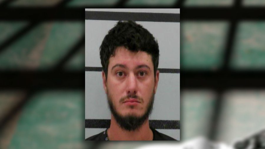 ugshot of Jason Boyd, a 30-year-old man with dark hair and a beard, following his arrest for intoxication assault in Lubbock.