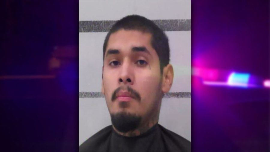 Mugshot of 22-year-old Miguel Silva of Lubbock, Texas, framed by a purple and blue police light graphic.