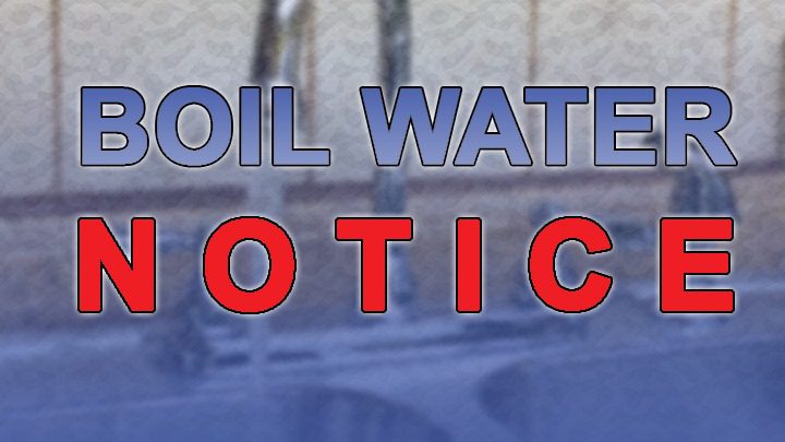 A graphic with bold text reading "Boil Water Notice" superimposed over a blurry, blue-tinted outdoor background.