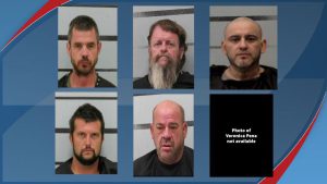 A grid of mugshots showing five male defendants and one black placeholder box for a missing photo of a female defendant involved in a Lubbock federal drug trafficking case.