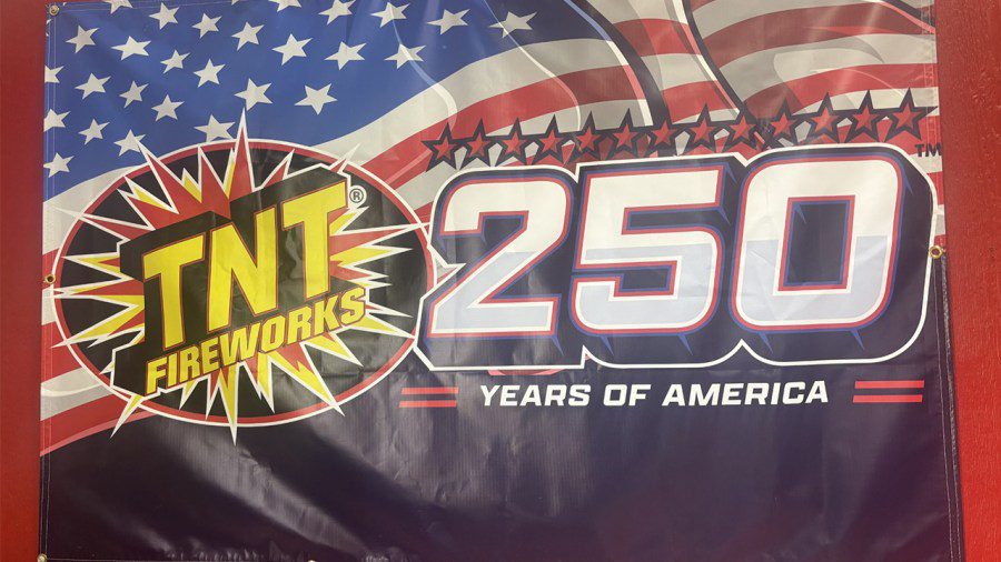 A vinyl promotional banner for TNT Fireworks celebrating the 250th anniversary of America.